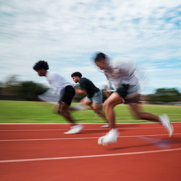 Athletes sprinting on the track during a speed session